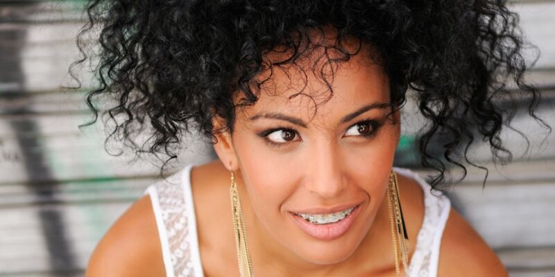 woman with clear fixed braces